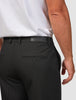 Essential Suit Pants Relaxed Fit Black featuring a branded leather-look patch on the back waistband and a single buttoned welt pocket.