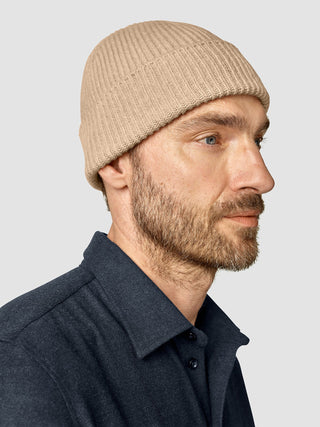 A man in profile wearing a Beanie Khaki.