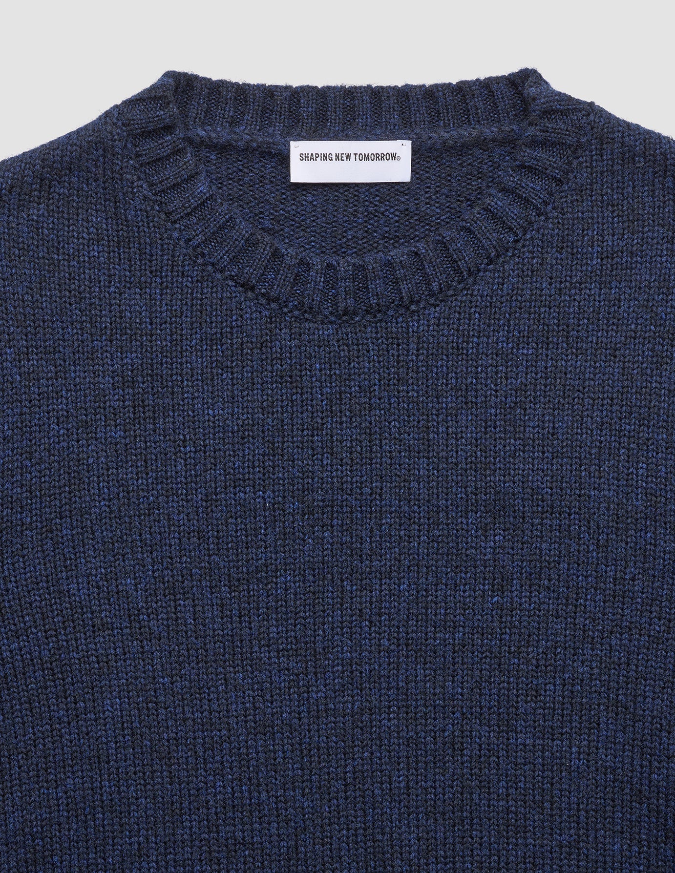 Chunky Soft Wool Knit Crewneck Dark Navy Melange featuring a ribbed neckline and a textured Scandinavian design.