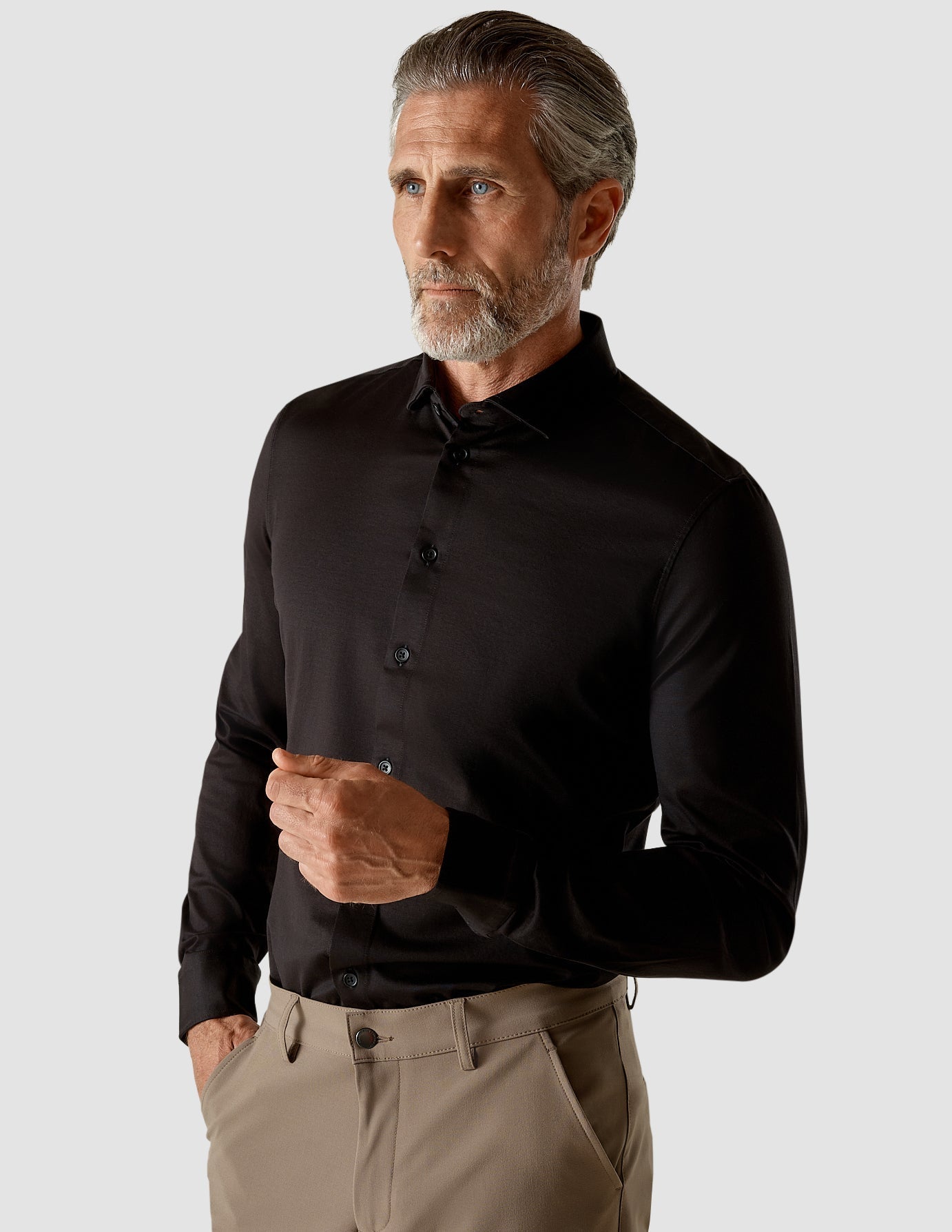 Model from the front wearing a Classic Shirt Black with brown pants