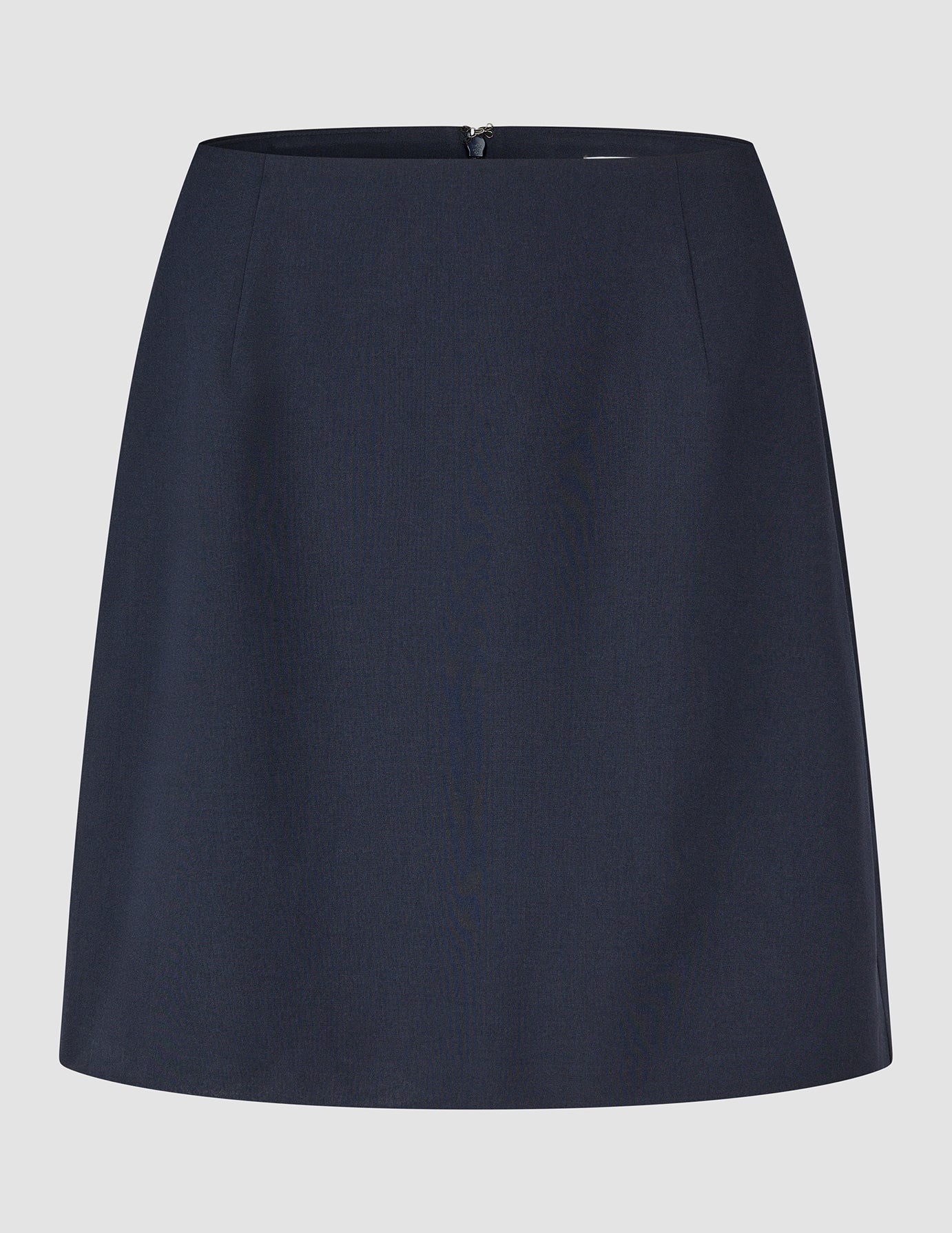 A navy blue Ease Set Blue Nights Blazer and Short Skirt A-line mini skirt with 360° stretch and a zipper closure at the back.