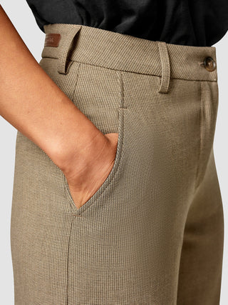 A person’s hand resting in the side pocket of tan, textured Essential Pants Straight Latte.