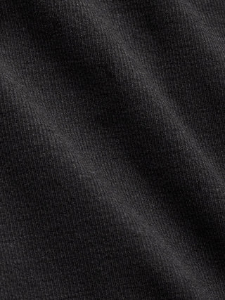 Close-up of a Rib Tank Top Black with visible folds.