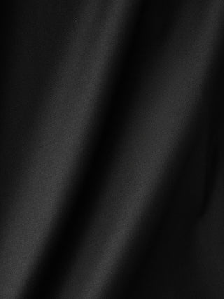 A close-up of lightweight Siena Shirt Black fabric with subtle diagonal folds.