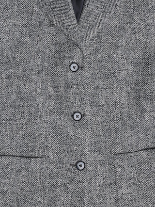 Close-up of a Women Ashryn Blazer Domino Herringbone with three dark buttons and a subtle bouclé texture.
