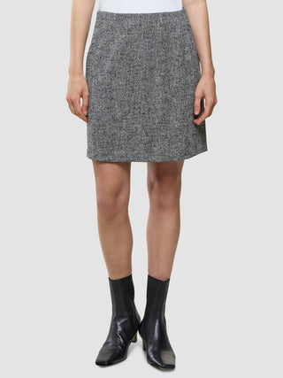 A Women Ashryn Short Skirt Domino Herringbone worn with black ankle boots.