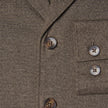 Close-up of an Atelier Overshirt Dark Beige in heavyweight twill, featuring dark horn-style buttons, a breast pocket, and a clean Scandinavian design.
