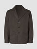 Atelier Overshirt in dark brown, a button-front blazer in heavyweight textured fabric featuring a notched lapel and two front patch pockets.