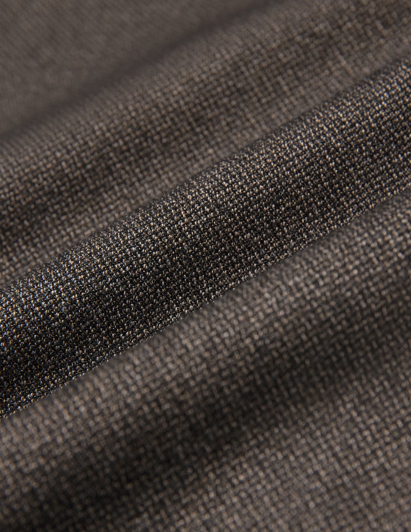Close-up of the folded dark brown Atelier Overshirt, showcasing a visible, heavyweight woven texture.