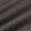 Close-up of the folded dark brown Atelier Overshirt, showcasing a visible, heavyweight woven texture.