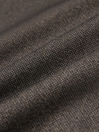 Close-up of the folded dark brown Atelier Overshirt, showcasing a visible, heavyweight woven texture.