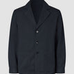Atelier Overshirt in dark navy featuring a notched collar, two front patch pockets, and a heavyweight textured finish.
