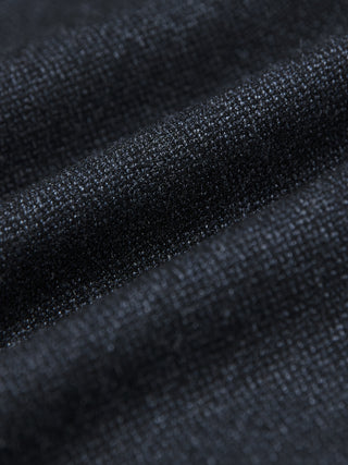 Close-up of the Atelier Overshirt Dark Navy, featuring a heavyweight, textured woven surface in a dark navy hue with soft folds.