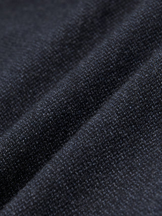 Close-up of dark navy blue heavyweight broken twill fabric from the Atelier Pants Relaxed Dark Navy, featuring a textured, knit-like weave shown in soft folds.