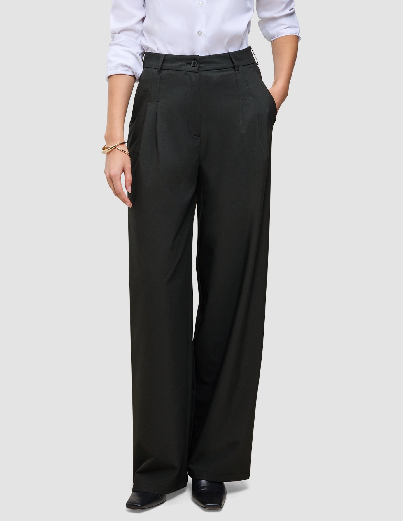 Black Women’s Avira Pants Wide paired with a white button-down shirt.