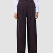 Women’s Avira Pants Wide Burgundy Berry featuring a high-waisted, wide-fit silhouette paired with a white button-down shirt.