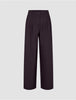 Women’s Avira Pants Wide Burgundy Berry in dark burgundy with a pleated front, button-fly closure, and a flattering wide-fit silhouette.