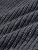 Close-up of a Beanie Dark Grey in merino wool with a rib knit and folded texture.