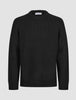 Chunky Soft Wool Knit Crewneck Black sweater featuring a minimalist Scandinavian aesthetic with a ribbed crew neckline, cuffs, and hem.