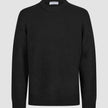 Chunky Soft Wool Knit Crewneck Black sweater featuring a minimalist Scandinavian aesthetic with a ribbed crew neckline, cuffs, and hem.