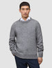 A man wearing a Chunky Soft Wool Knit Crewneck Glacier Grey sweater over a white collared shirt.