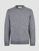 Chunky Soft Wool Knit Crewneck Glacier Grey sweater in a chunky, grey crewneck style with a classic Scandinavian design, ribbed cuffs, and hem.