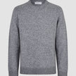 Chunky Soft Wool Knit Crewneck Glacier Grey sweater in a chunky, grey crewneck style with a classic Scandinavian design, ribbed cuffs, and hem.