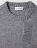 Chunky Soft Wool Knit Crewneck Glacier Grey sweater in a grey marled Scandinavian design with a chunky knit, ribbed collar, and sleeve cuffs.