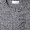 Chunky Soft Wool Knit Crewneck Glacier Grey sweater in a grey marled Scandinavian design with a chunky knit, ribbed collar, and sleeve cuffs.