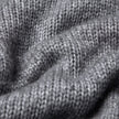 Close-up of a grey, chunky knit Chunky Soft Wool Knit Crewneck Glacier Grey sweater with visible yarn texture.