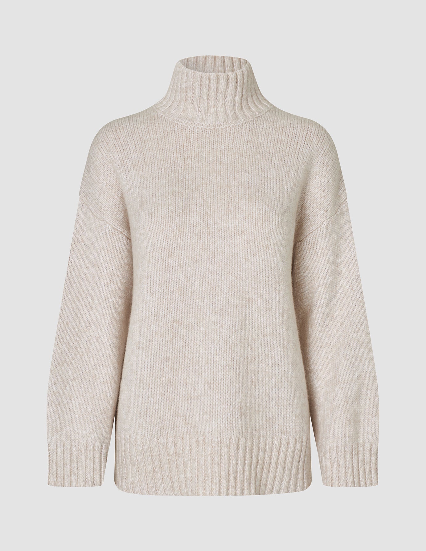 Women’s Chunky Soft Wool Knit Turtleneck Sugar Melange in beige, featuring a chunky wool knit, turtleneck, and ribbed cuffs and hem.