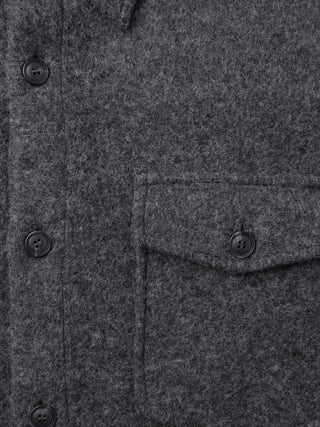 Close-up of a Double Layer Wool Overshirt Regular Dark Grey featuring a buttoned placket and a single chest pocket with a matching button.
