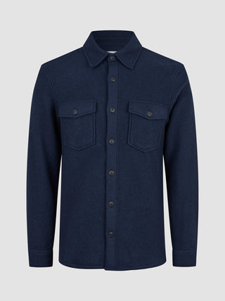 Dark navy Double Layer Wool Overshirt Regular Dark Navy featuring a collar, two chest pockets, and a long-sleeved double-layer wool design reflecting minimalist Scandinavian style.