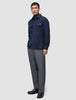 A man wears a Double Layer Wool Overshirt Regular Dark Navy over a brown turtleneck, paired with grey trousers and dark leather loafers in a minimalist Scandinavian style.