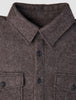 Close-up of a Double Layer Wool Overshirt Saddle Brown, featuring a brown wool design with a pointed collar, button-down front, and two buttoned chest pockets.