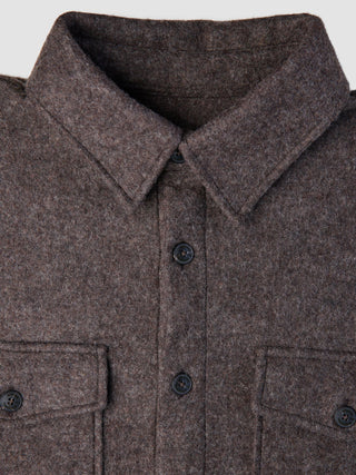 Close-up of a Double Layer Wool Overshirt Saddle Brown, featuring a brown wool design with a pointed collar, button-down front, and two buttoned chest pockets.
