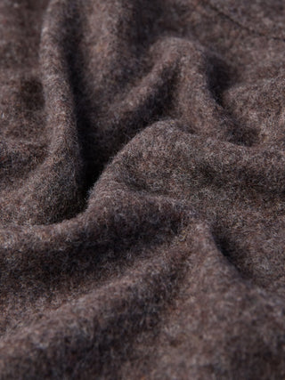 Close-up of the Double Layer Wool Overshirt Saddle Brown featuring brown textured fabric with soft folds.
