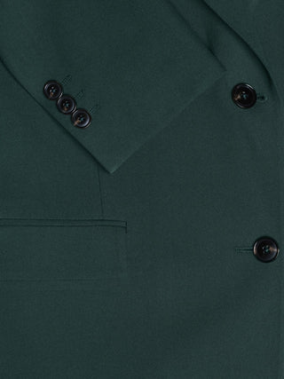 Close-up of a dark green Women Ease Blazer Evergreen sleeve and pocket, showcasing a minimalist Scandinavian design.