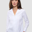 Woman wearing a white long-sleeved Madison Shirt White in 100% cotton with a notched collar.