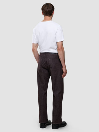 A man viewed from behind, wearing a white crew-neck t-shirt and Marco Jeans Dark Brown.