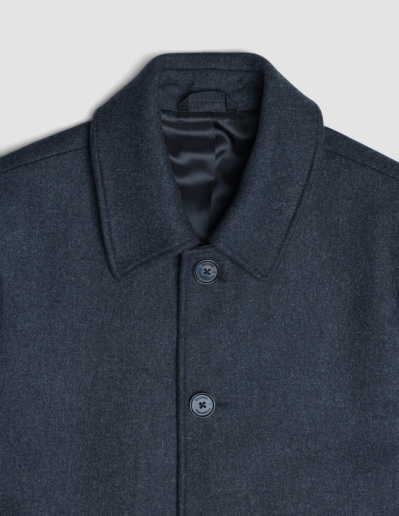 Close-up of a dark grey Maxi Wool Coat featuring a collared neckline and a front button closure.