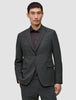A man wearing a lightweight, breathable Motion Blazer Slim Pepper Grey over a dark button-down shirt.