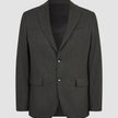 The Motion Blazer Slim Pepper Grey is a tailored, two-button, charcoal grey blazer in lightweight, breathable fabric with notched lapels, two flap pockets, and a chest pocket.