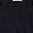 Close-up of the waistband and top of Motion Suit Pants Regular Midnight Blue, featuring a button closure and internal brand label on 360° stretch dark blue fabric.