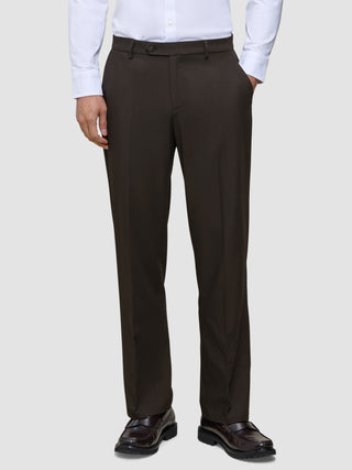 A person wearing a crisp white dress shirt and Motion Suit Pants Relaxed Cognac in a straight-leg fit, paired with dark brown leather loafers.
