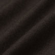 Close-up view of dark brown, 360° stretch fabric with subtle folds on the Motion Suit Pants Slim Cognac.