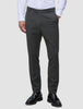 A man wearing a white dress shirt, Motion Suit Pants Slim Pepper Grey, and black loafers.