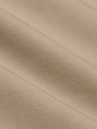 Close-up view of folded Refine Cotton Pants Relaxed Fit Sand.