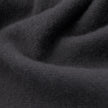 Close-up of a Scarf Charcoal Grey in soft, deep folds of cashmere.