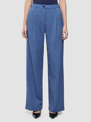 A person wearing Women Serene Pants Wide Ombre Blue Herringbone with a high-waisted, Scandinavian design.